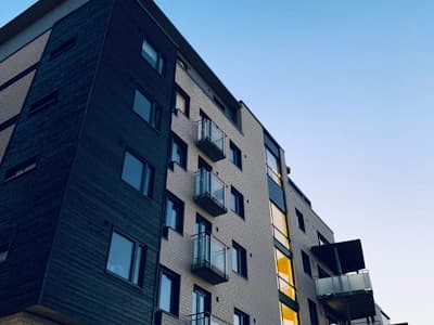 Modern apartment building with security presence