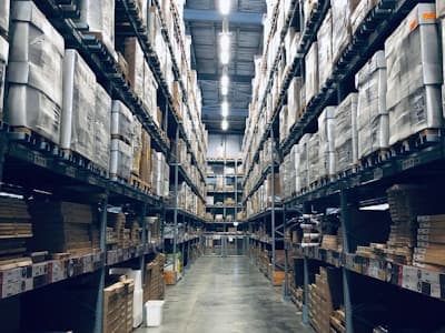 Warehouse interior with security cameras and staff monitoring